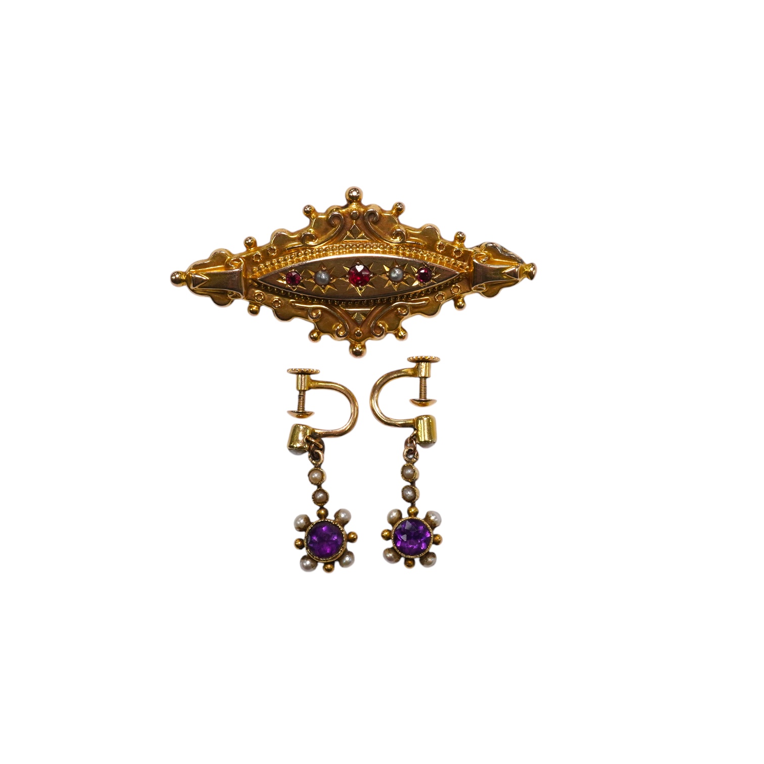 A pair of antique yellow metal, amethysts and seed pearl set drop earrings, 22mm and a Victorian 9ct, ruby and split pearl set brooch, gross weight 6.6 grams. Condition - fair to good